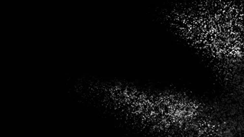 The spread of a large number of shiny microparticles of fine dust on a black Stock Footage 136309053