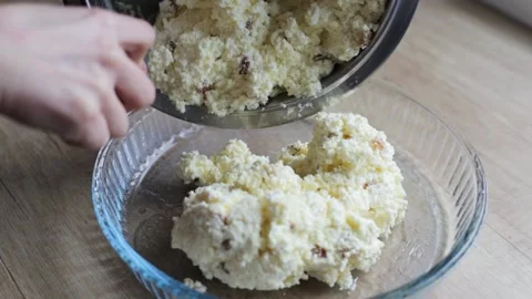 Spread the mass for the preparation of the pie in a transparent baking sheet. Stock Footage 229857938