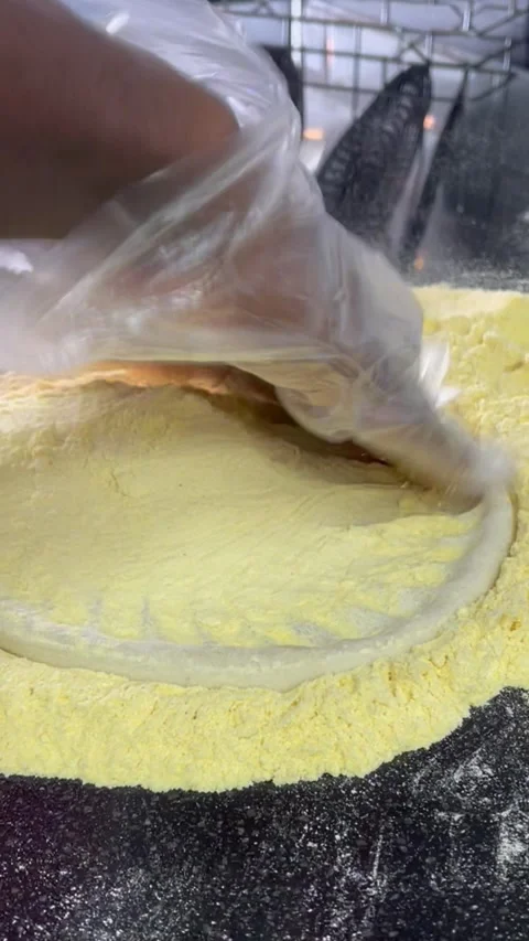 Spread the pizza with corn flour Stock Footage 327455929