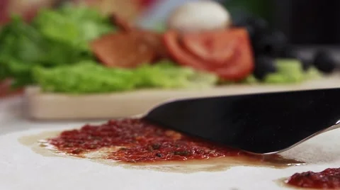 Spread the tomato sauce over the dough, pizza, SLOW MOTION Stock Footage 45955419