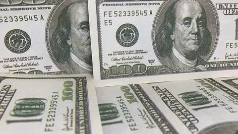 Spread of U.S. hundred-dollar banknotes illustrating cash circulation, Stock Photos