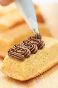 Spread whipped cream on bread Stock Photos