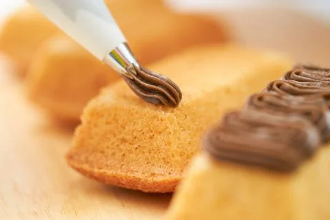 Spread whipped cream on bread Stock Photos