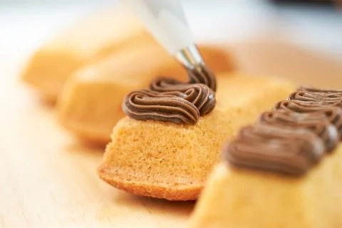 Spread whipped cream on bread Stock Photos