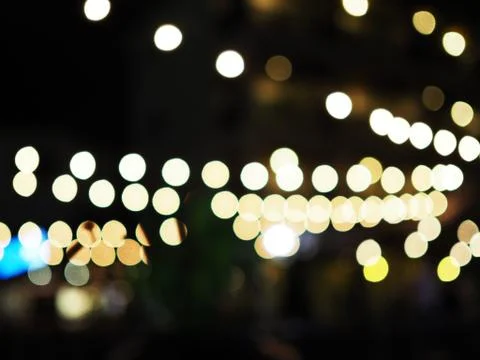 Spread white clear bokeh ball row, black background Foto stock