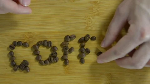 Spread the word coffee from roasted coffee beans Stock Footage 122728116