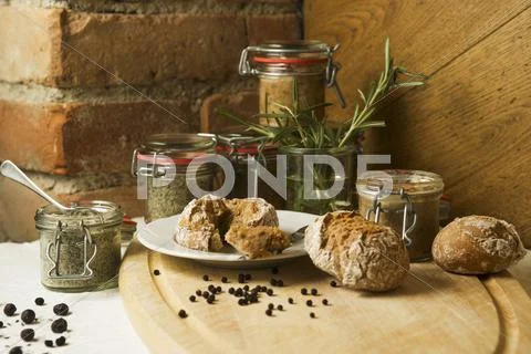 Spreadable liver sausage and a herb spread with bread rolls Stock Photos