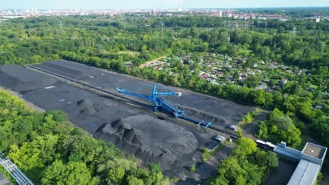Spreader coal Excavator at a coal storage. Great aerial view flight drone Stock Footage 314199337