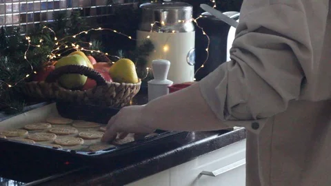 Spreading on a baking tray ginger cookies for baking. Stock Footage 129178893