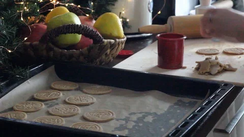 Spreading on a baking tray ginger cookies for baking. Stock Footage 129178997