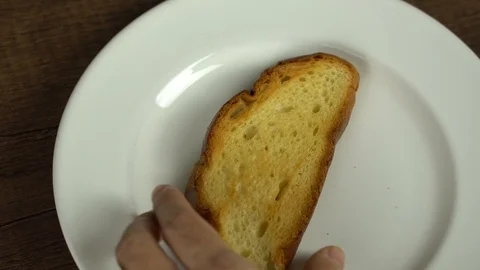 Spreading butter on baked bread Stock Footage 113074211