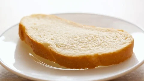 Spreading butter on bread Stock Footage 81249579