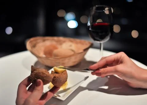 Spreading butter on bread Stock Photos