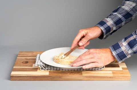 Spreading Butter on Bread Stock Photos