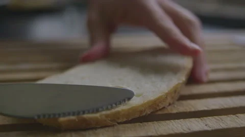 Spreading butter on bread, slow motion Stock Footage 57638939