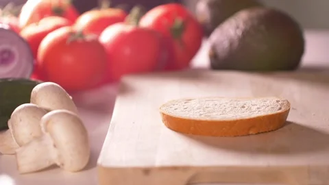 Spreading butter on slice of bread. Stock-Footage 138403952