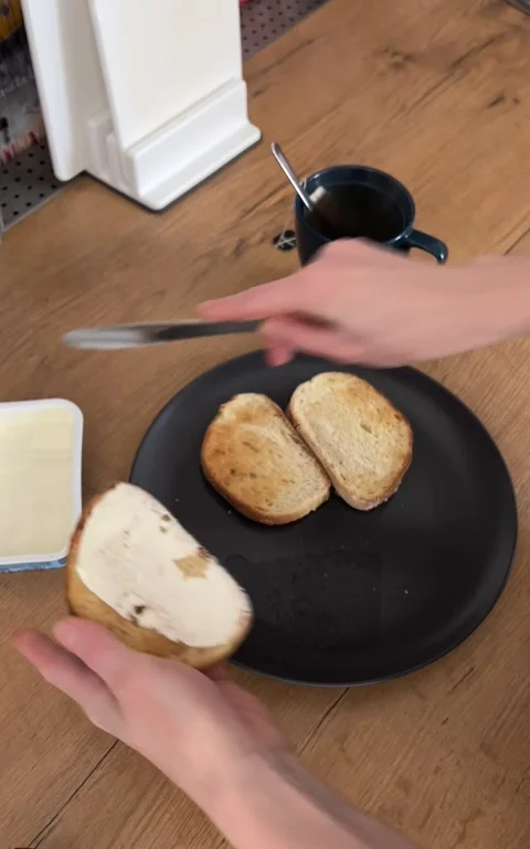 Spreading Butter on a Toast Stock Footage 303189492