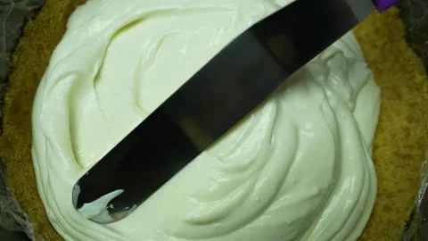Spreading Cheese Layer While Preparation Cheesecake. Top View Stock Footage 243593057