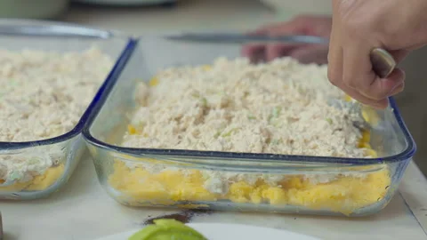 Spreading Chicken Salad Layer for Traditional Peruvian Causa Limeña Assembly Stock Footage 338340918