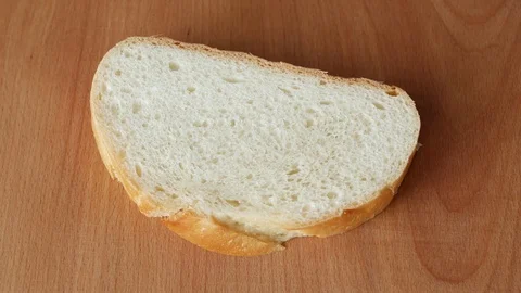 Spreading chocolate paste on white bread. Stock Footage 72175298