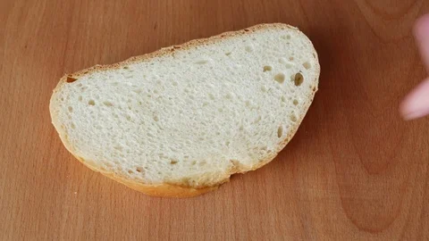 Spreading chocolate paste on white bread. Stock Footage 72175309