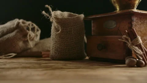 Spreading coffee grains from fallen authentic burlap sack. Slow motion Stock Footage 138521350