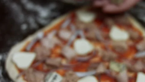 Spreading danish blue cheese over pizza dough. Preparing heart shaped tuna pizza Stock Footage 146927161