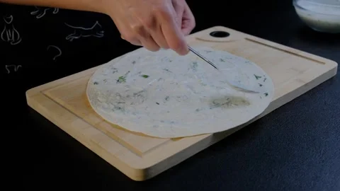 Spreading Dip on Flatbread in Cooking Kitchen Video stock 341421443