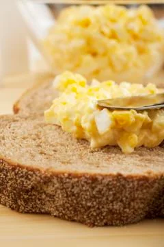 Spreading egg mayonnaise on bread Stock Photos