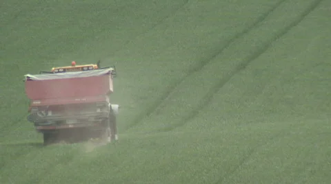 Spreading fertiliser pellets 2 Stock Footage 396824