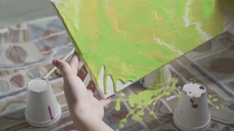 Spreading Green Paint on Canvas Stock Footage 139265435