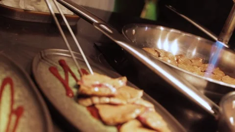  spreading herbs on slices of roast meat Stock Footage 300028241