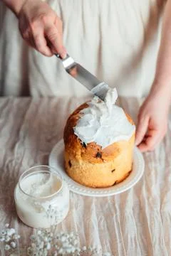 Spreading icing on homemade easter panettone, top view. Foto stock