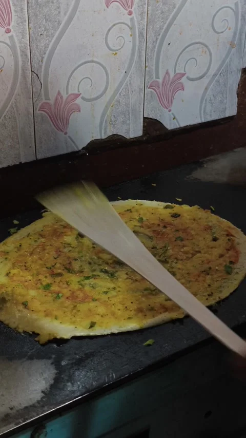 Spreading Masala on Dosa While Cooking on Hot Tawa Stock Footage 327982228