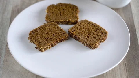 Spreading mashed avocado on toast. Healthy vegan breakfast. Video stock 104657585