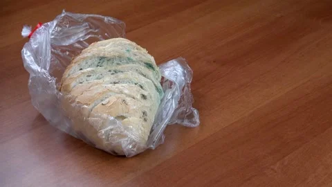 Spreading of mold over bread Stock Footage 131997728