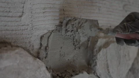 Spreading mortar on a scratch coat wall  Видео 339284223