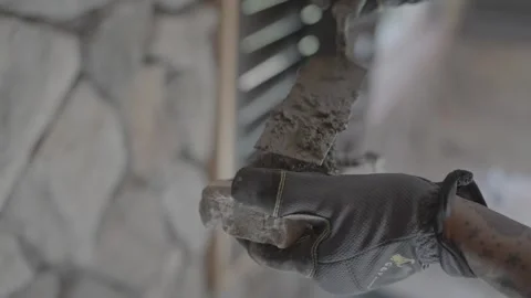 Spreading mortar on stone for wall 動画素材 339284210