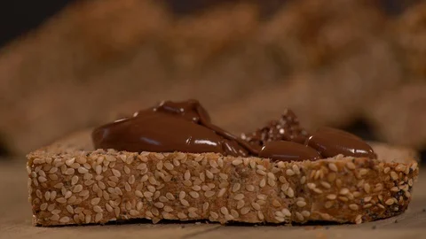 Spreading Nutella on a Slice Of Bread Vídeos de archivo 130135100