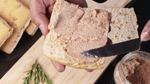 Spreading Pate On a piece of Bread Stock Footage 248744504