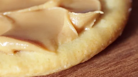 Spreading Peanut Butter on a Cracker Close-Up Stock Footage 48921308