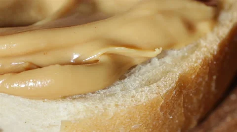 Spreading Peanut Butter on White Bread Close-Up Stock Footage 48921210