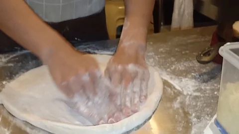Spreading Pizza Dough Using Hands (Close Up) Stock Footage 108520270
