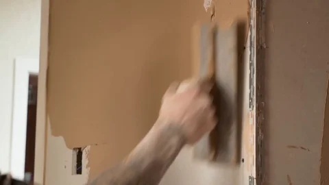 Spreading plaster skim on corner wall plaster boards 2 Stock Footage 82009758