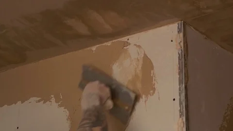 Spreading plaster skim on to plaster boards 2 Stock Footage 82009560