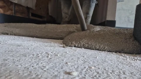 Spreading polystyrene concrete in apartment hallway low angle shot Stock Footage 341510053