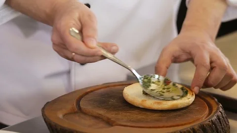 Spreading sauce to burger bread Stock Footage 74716052