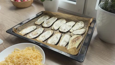 Spreading Sauce On Eggplant Slices Preparing Vegetable Bake Close Cooking Scene Video stock 336445987