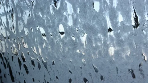 Spreading of soap scum on the windshield of a car during an automatic car wash. Stock Footage 156056851