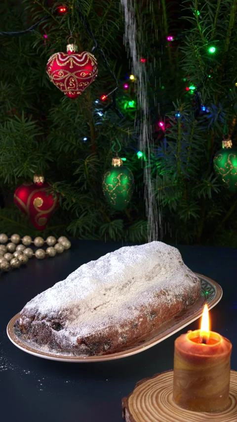 Spreading sugar powder on  Stollen cake.  Vertical video. Stock Footage 282800943